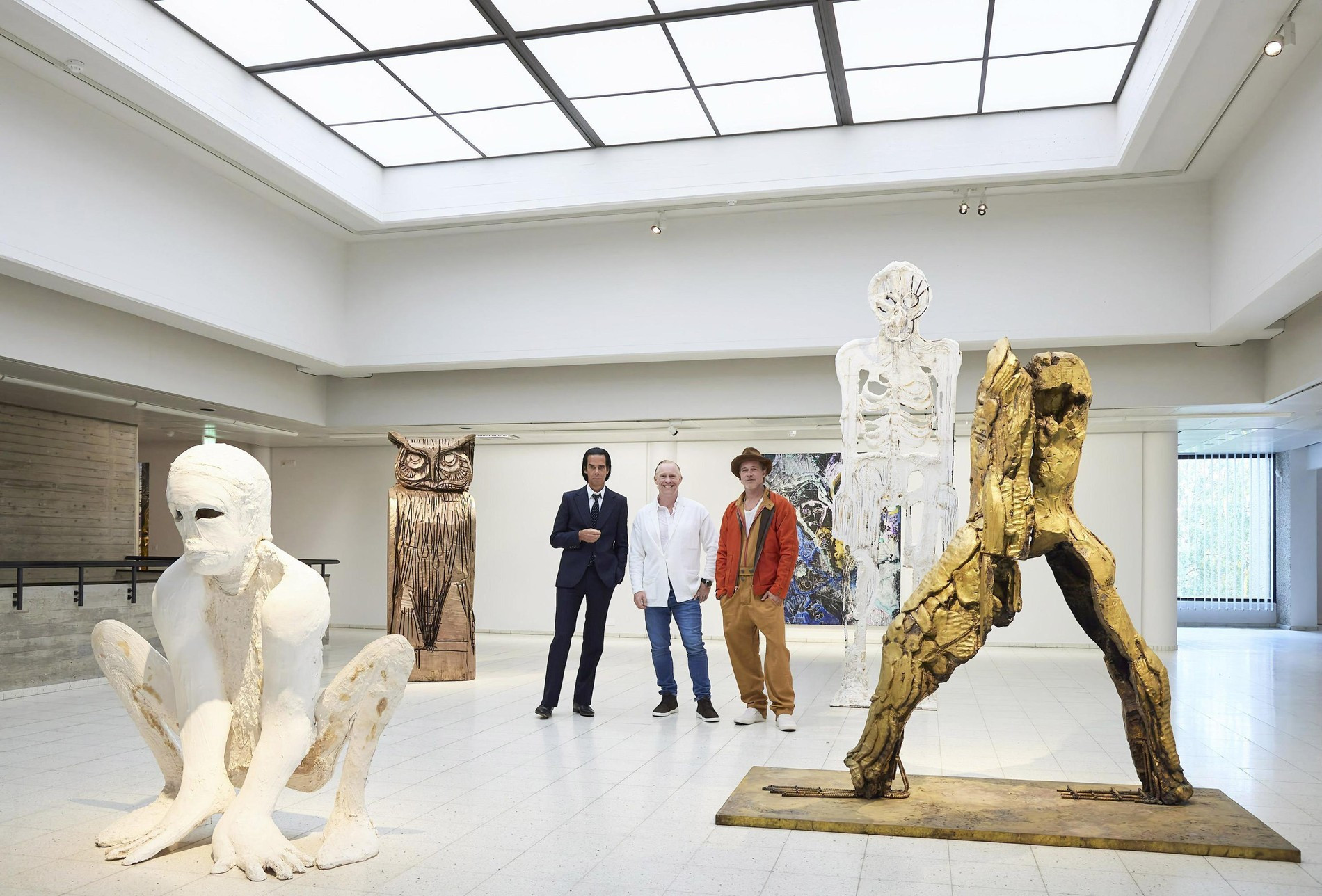 Кейв, Хаусаго и Питт со своими работами на выставке в Тампере 
Фото: AFP