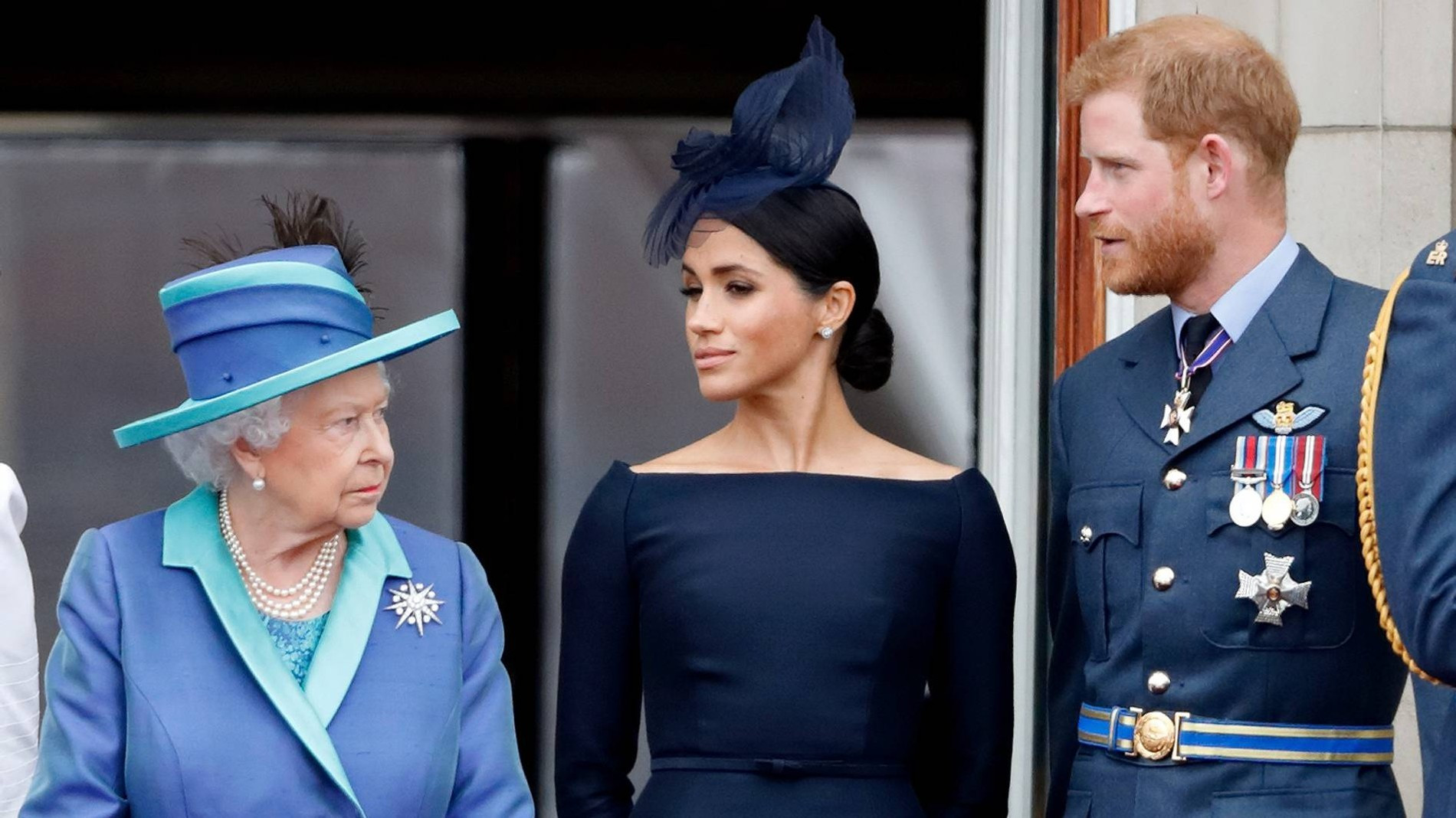 Елизавета II, Меган Маркл и принц Гарри. Фото: Getty Images